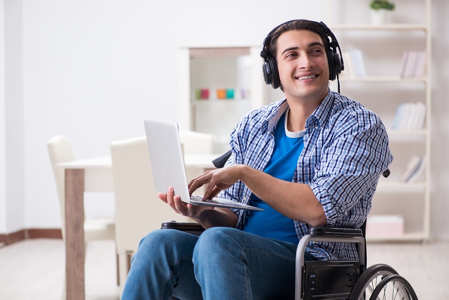 bigstock-Disabled-man-listening-to-musi-237420679